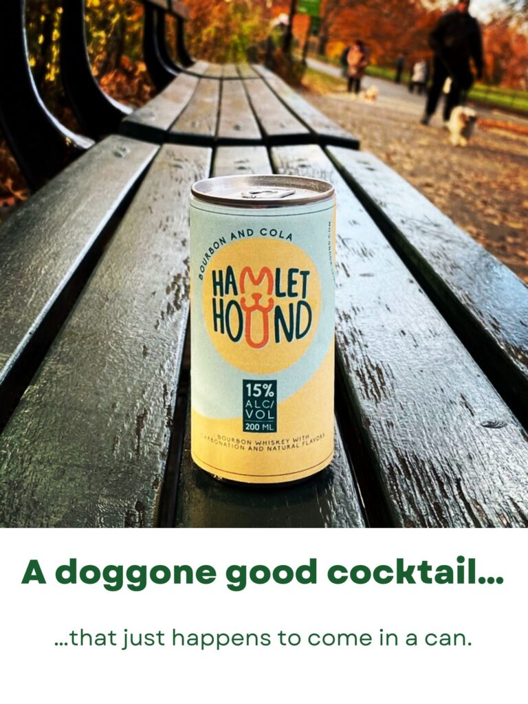 A can of Hamlet Hound bourbon and cola on a park bench with a dog in the background. The caption reads: A doggone good cocktail....that just happens to come in a can.